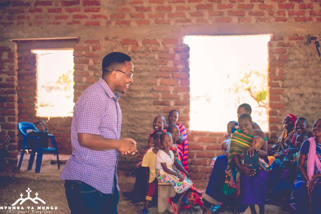 Aloyce facilitating a community conversation